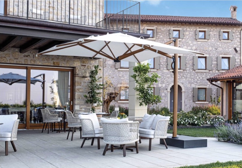 The Universe Of Umbrellas, Galaxia Catalogue 2022 3 Astro Timber Scolaro umbrella on Italian villa patio