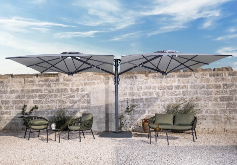 The Universe Of Umbrellas, Galaxia Catalogue 2022 1 Dual "V" Carbon Scolaro umbrella with armchairs below
