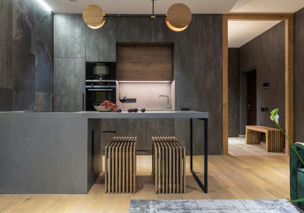 Best Furniture Design Materials for Sustainable Interiors 7 Sleek modern kitchen with a minimalist style and elegant lighting.