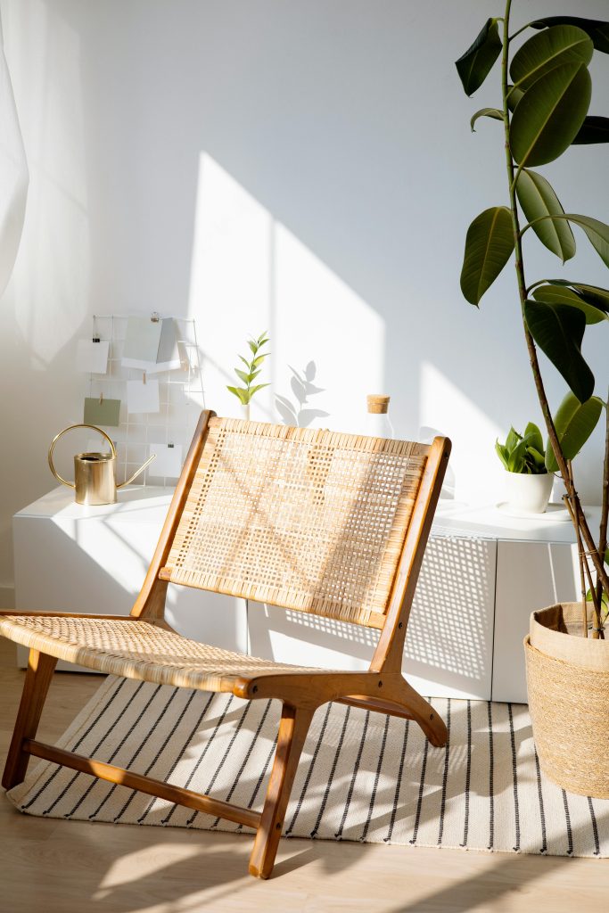 Best Furniture Design Materials for Sustainable Interiors 3 Sunny room with rattan chair and indoor plants, perfect for modern decor lovers.